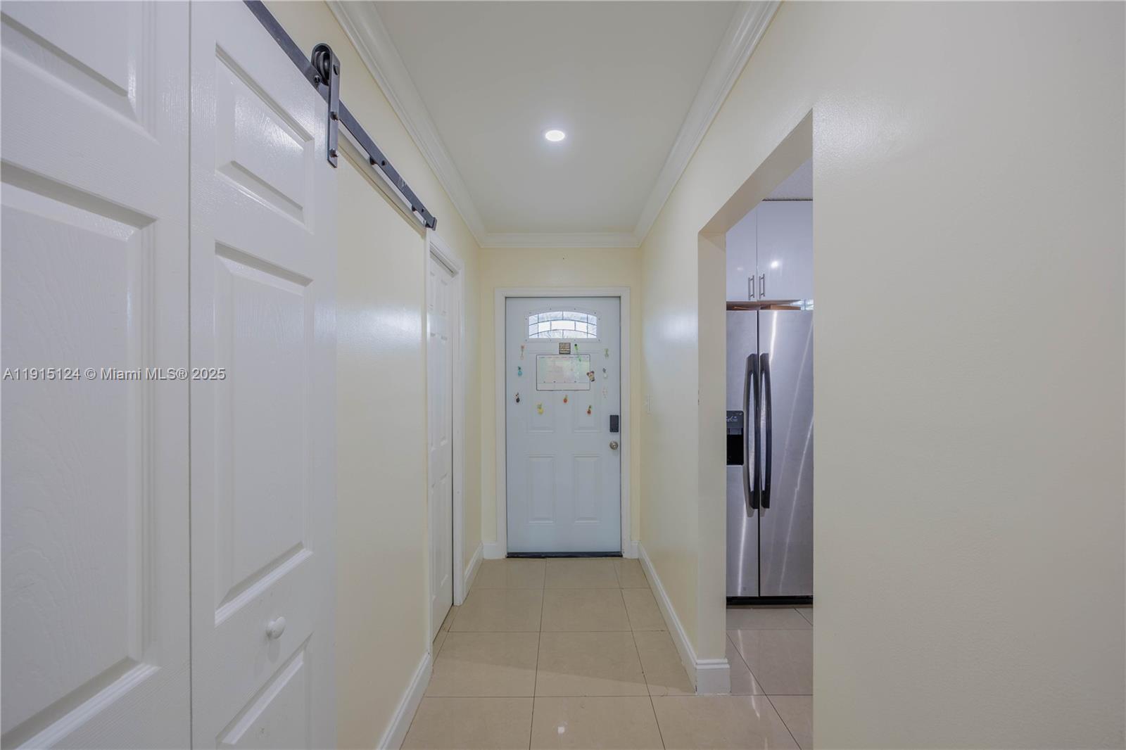 8325 Fairway Road Sunrise, FL 33351 - Photo 1 of 18 a view of a hallway with windows and closet