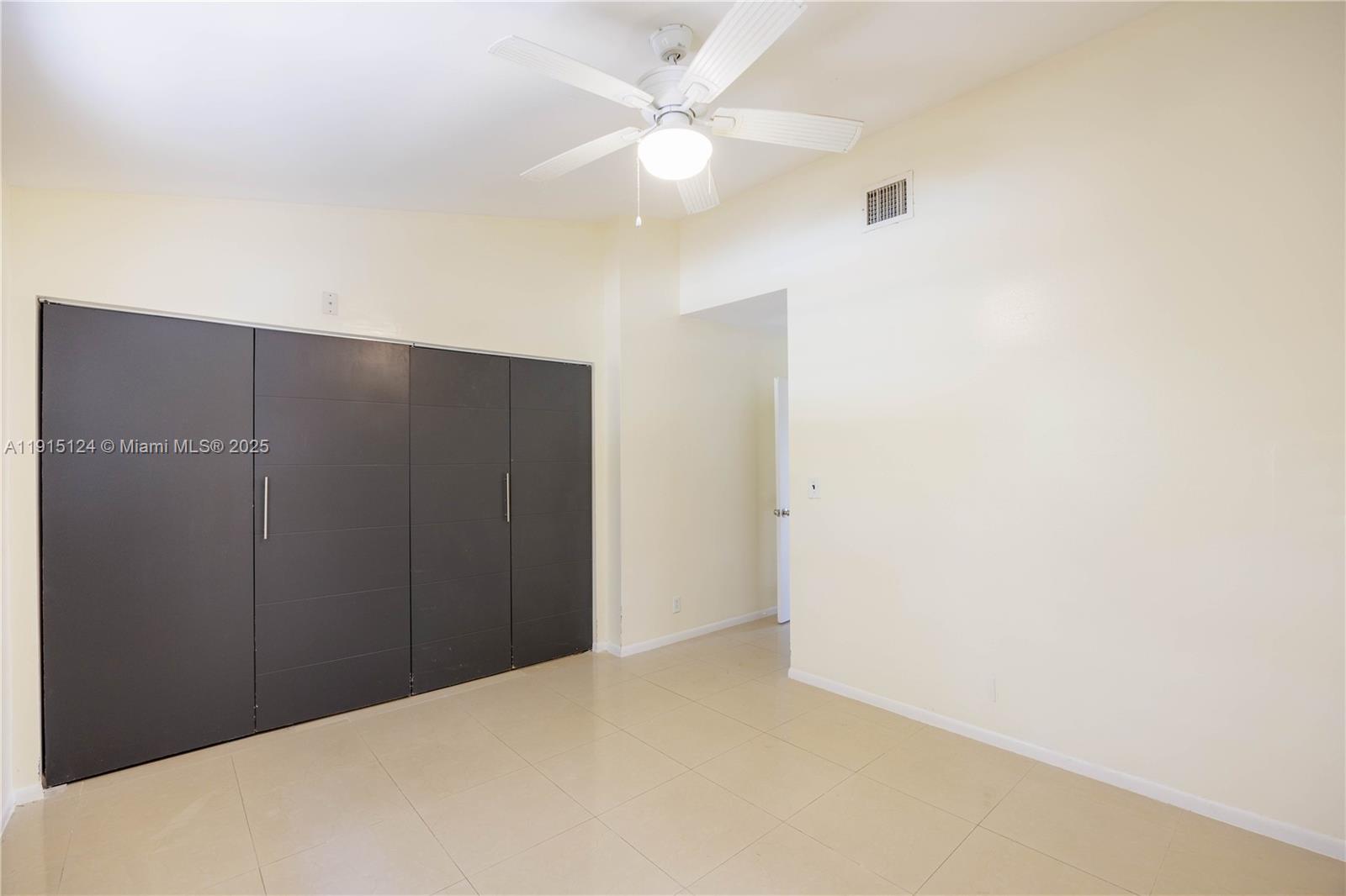 8325 Fairway Road Sunrise, FL 33351 - Photo 11 of 18 a view of an empty room
