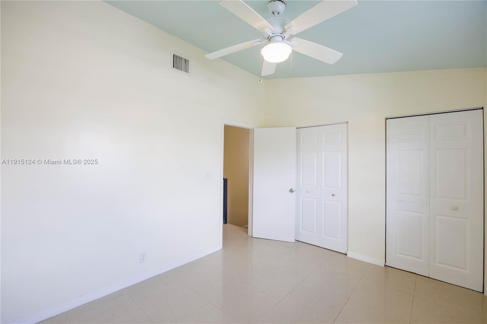 8325 Fairway Road Sunrise, FL 33351 - Photo 13 of 18 a view of an empty room