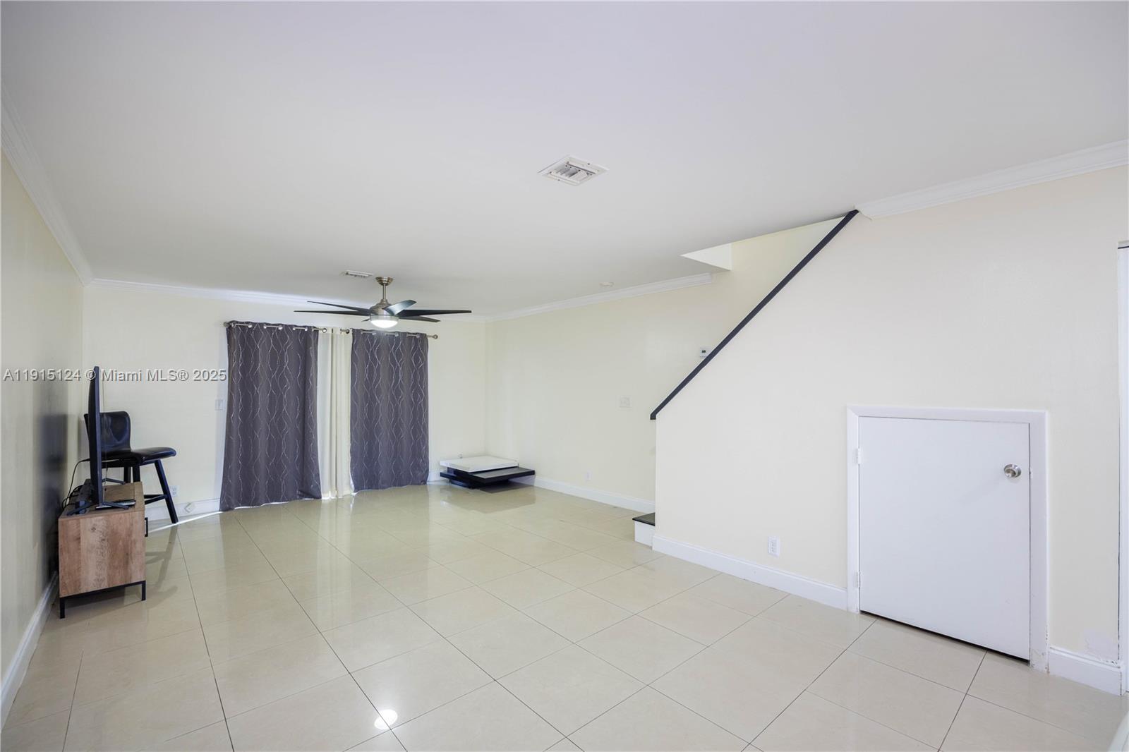 8325 Fairway Road Sunrise, FL 33351 - Photo 8 of 18 a view of an empty room with a window