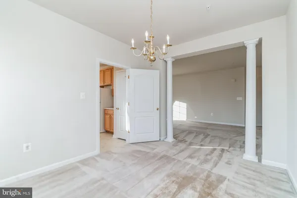a view of a chandelier in an empty room
