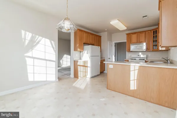 a view of a kitchen with furniture and a window