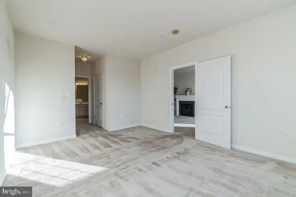 a view of an empty room with a closet