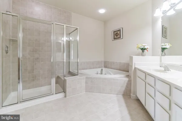 a bathroom with a bathtub and a sink