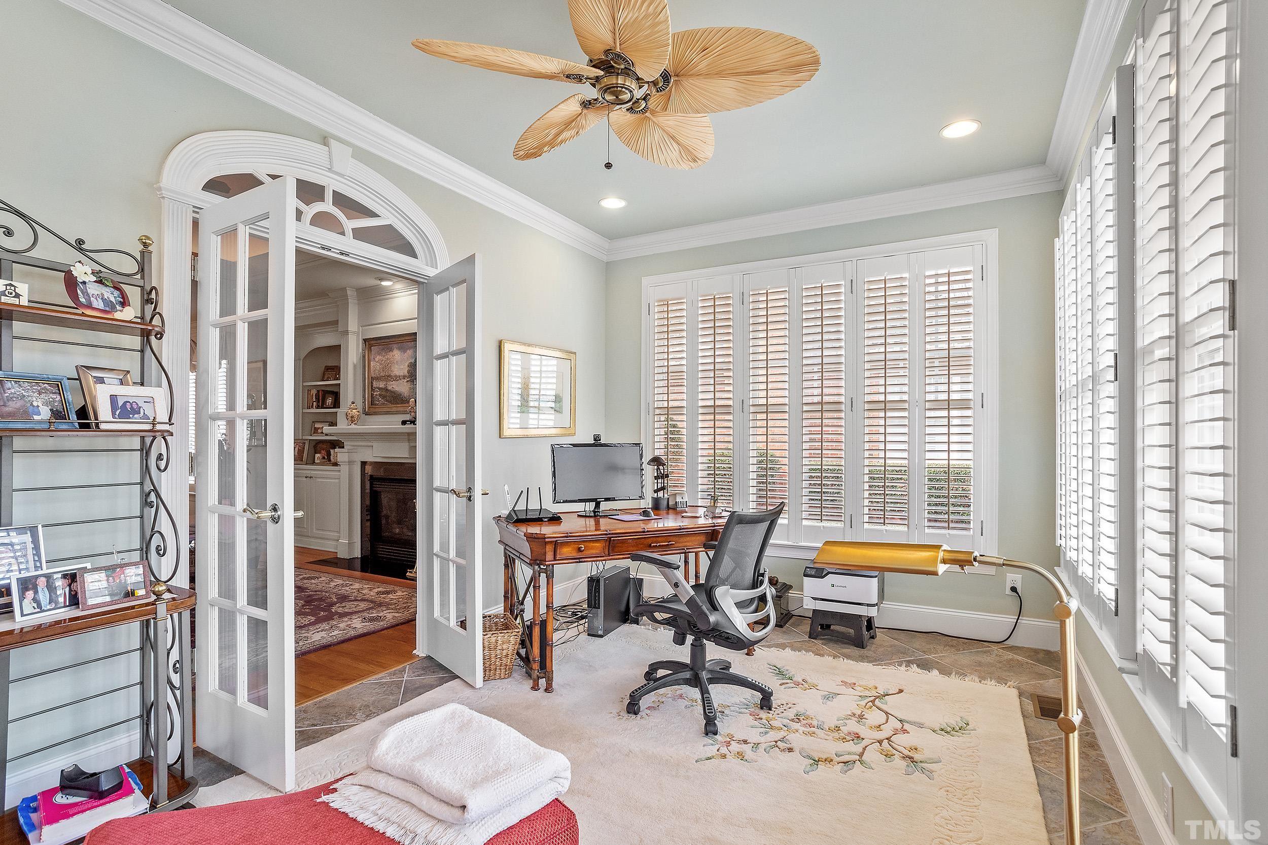 1812 Middlebrook Drive Raleigh, NC 27615 - Photo 16 of 39 a view of a livingroom with workspace and a window