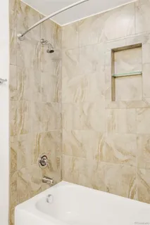 a bathroom with a shower and a sink