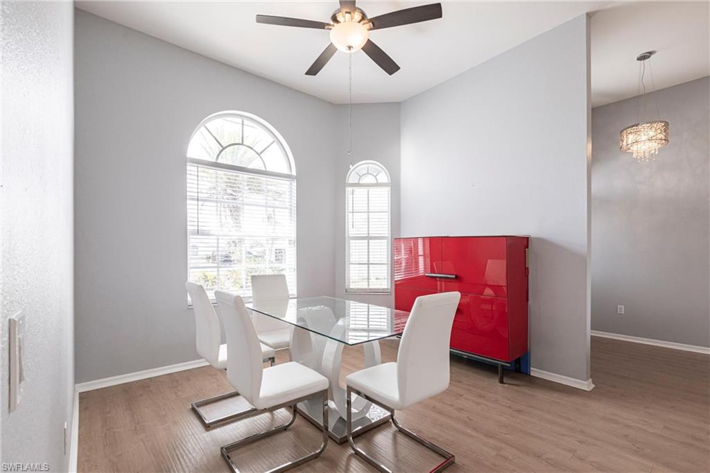7306 Powder Puff Punta Gorda, FL 33955 - Photo 12 of 34 a view of a dining room with furniture window and wooden floor