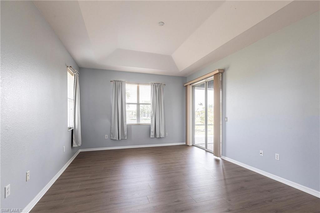 7306 Powder Puff Punta Gorda, FL 33955 - Photo 16 of 34 an empty room with wooden floor and windows