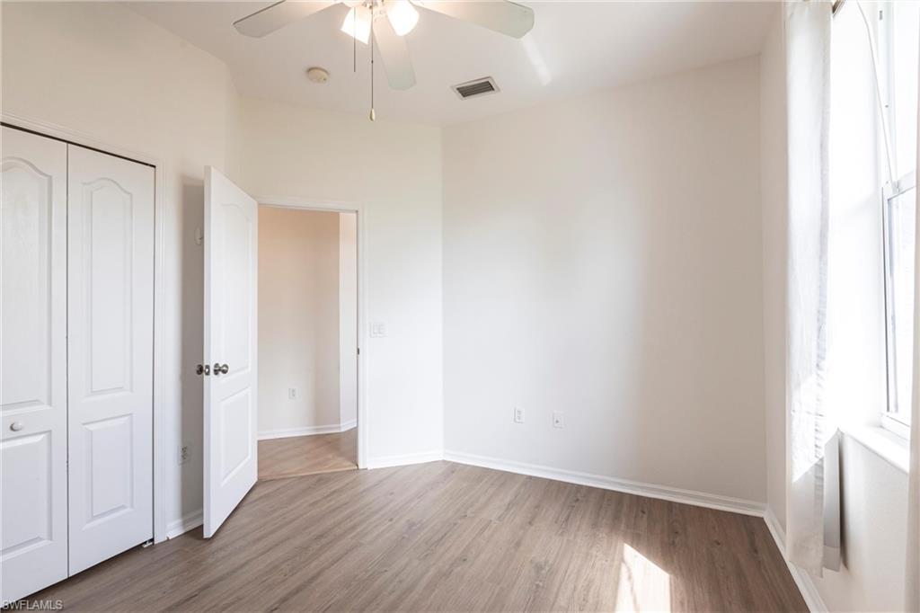 7306 Powder Puff Punta Gorda, FL 33955 - Photo 23 of 34 a view of an empty room with wooden floor