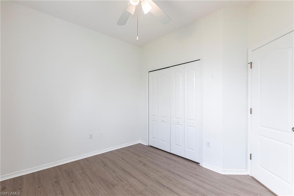 7306 Powder Puff Punta Gorda, FL 33955 - Photo 24 of 34 a view of an empty room with wooden floor
