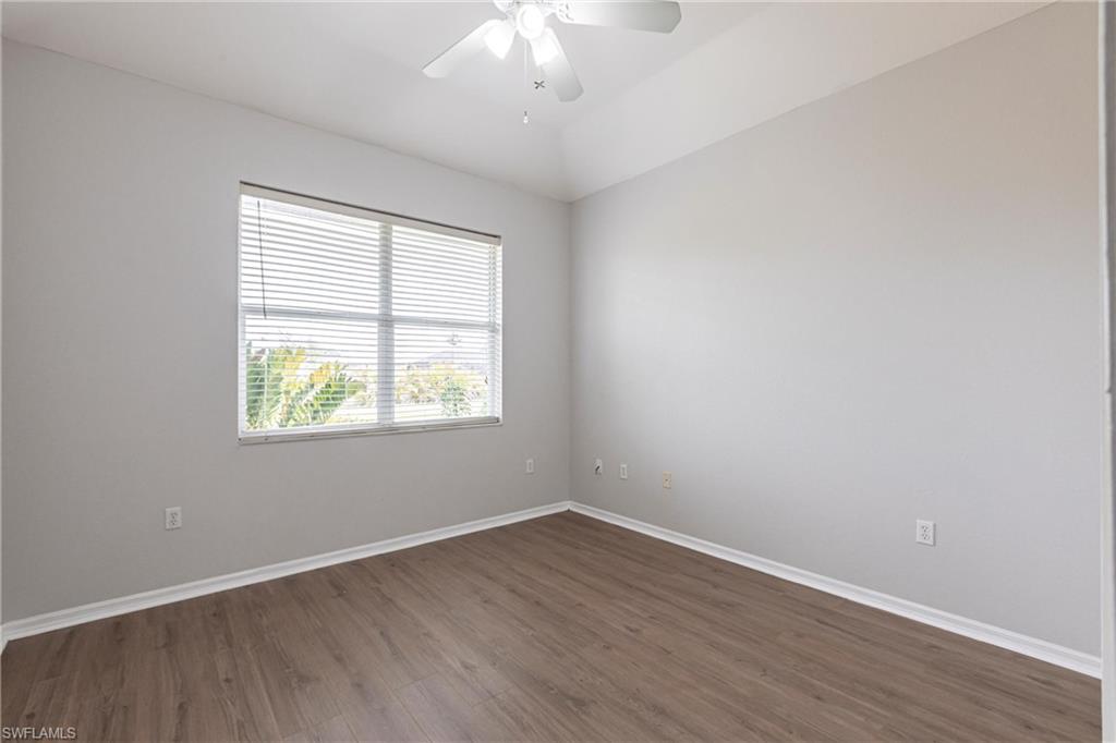 7306 Powder Puff Punta Gorda, FL 33955 - Photo 26 of 34 an empty room with wooden floor and windows