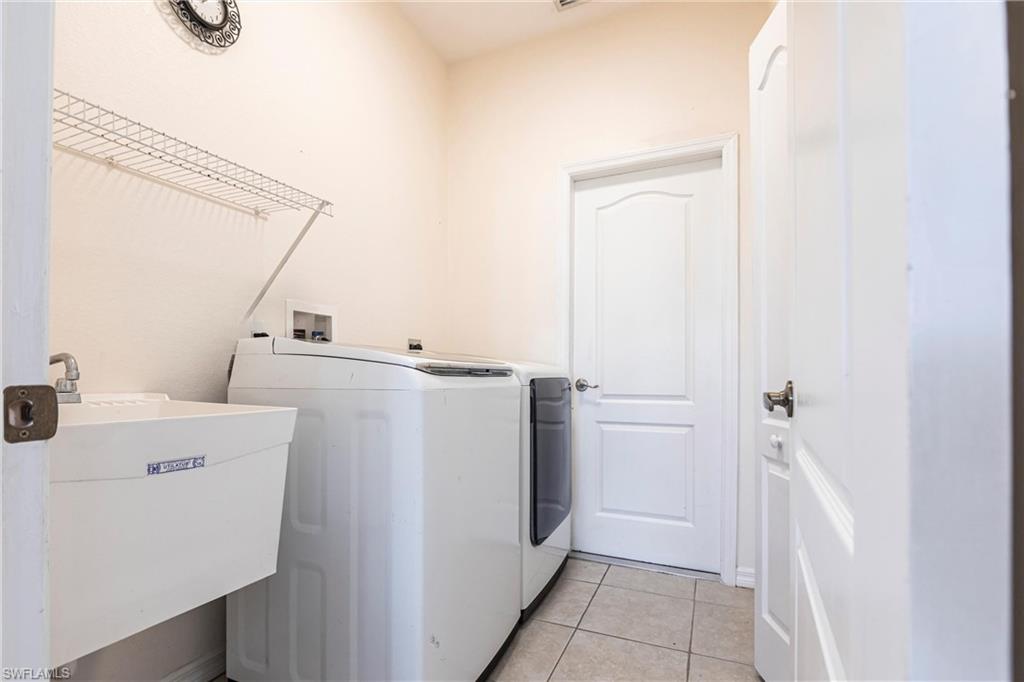 7306 Powder Puff Punta Gorda, FL 33955 - Photo 29 of 34 a utility room with dryer and washer