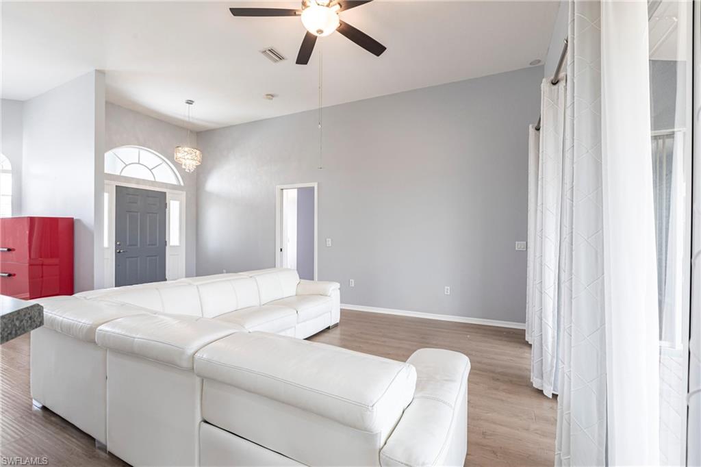 7306 Powder Puff Punta Gorda, FL 33955 - Photo 4 of 34 a bedroom with a bed and a chandelier