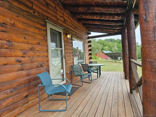 a view of a chairs and table on the wooden floor