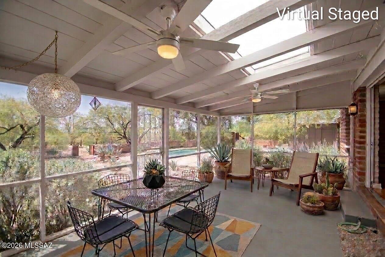 4130 East River Road Tucson, AZ 85718 - Photo 25 of 46 a dining room with furniture water view and a floor to ceiling window