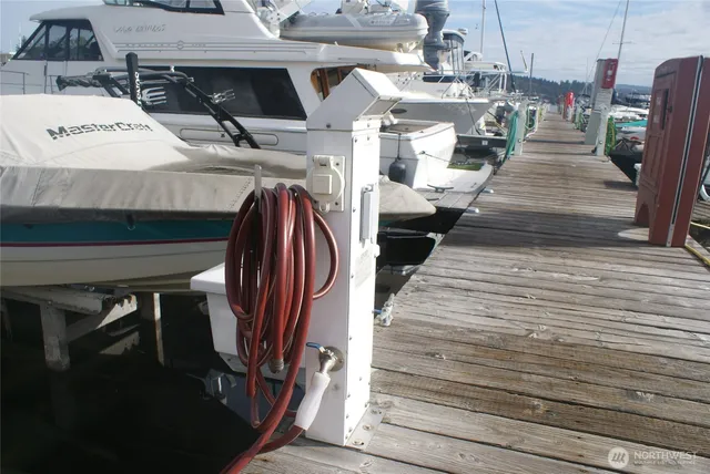 a roof deck with table and chairs