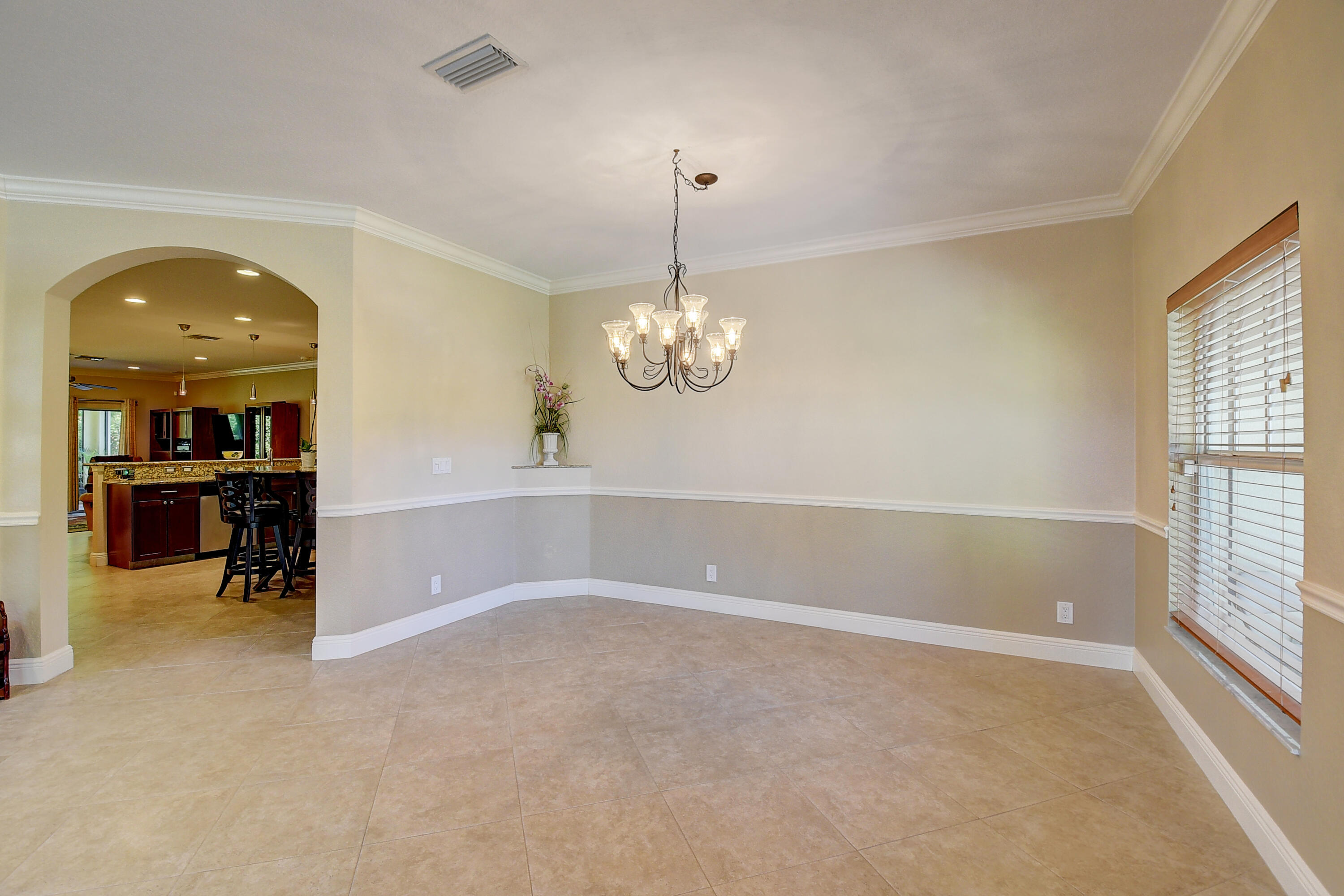 215 Gulfstream Boulevard Boynton Beach, FL 33435 - Photo 11 of 39 wooden floor in an empty room with a window
