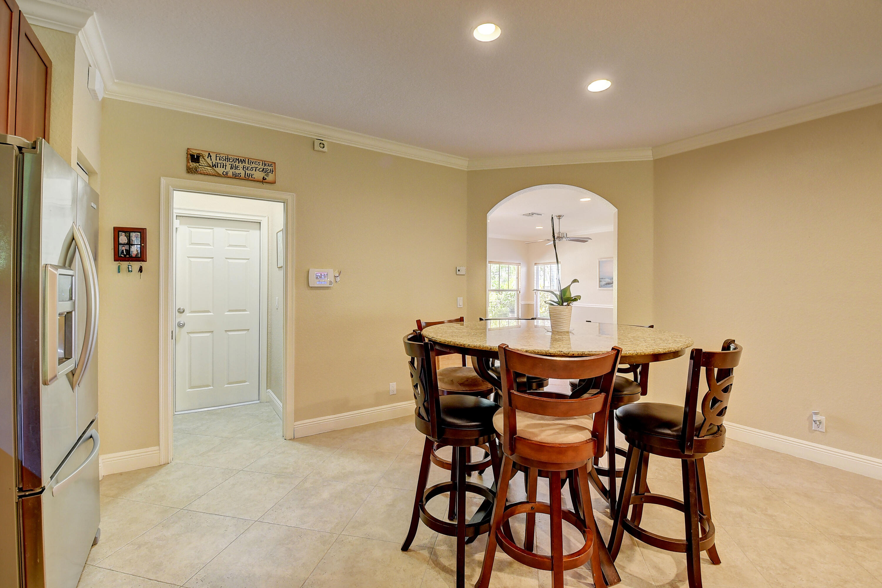 215 Gulfstream Boulevard Boynton Beach, FL 33435 - Photo 16 of 39 a view of a dining room with furniture and wooden floor
