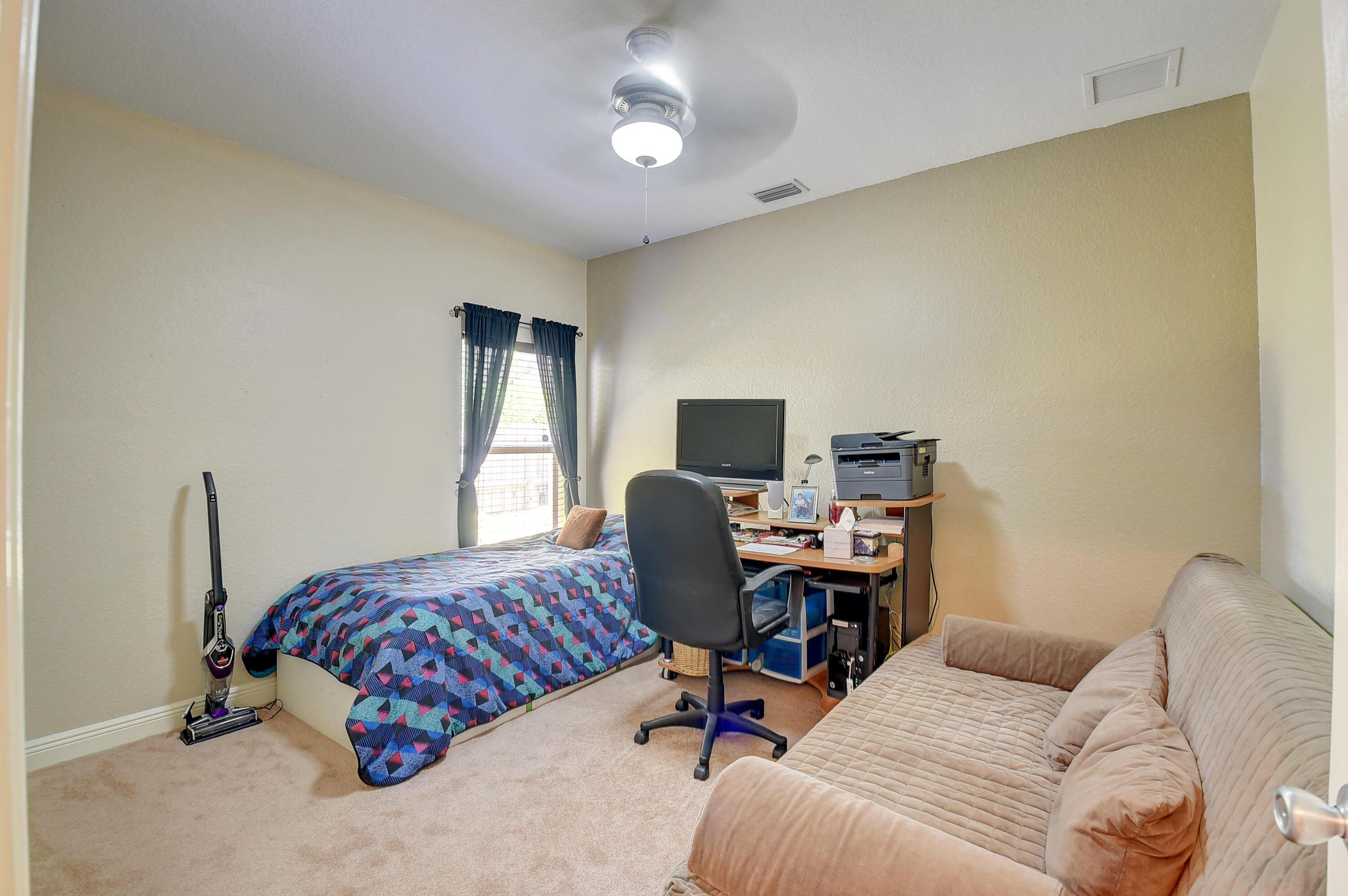 215 Gulfstream Boulevard Boynton Beach, FL 33435 - Photo 29 of 39 a bedroom with a bed and a desk