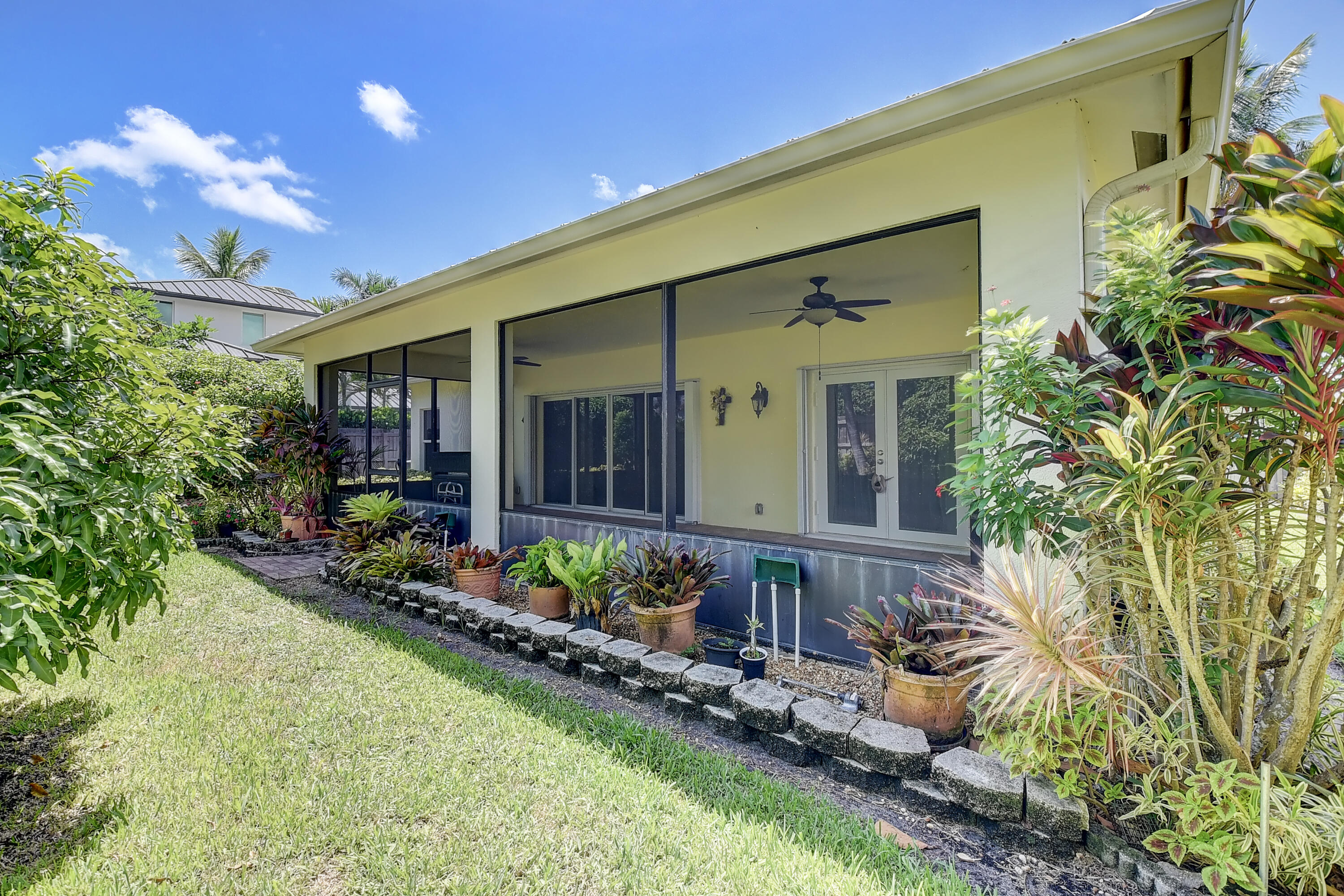 215 Gulfstream Boulevard Boynton Beach, FL 33435 - Photo 32 of 39 a front view of a house with a yard
