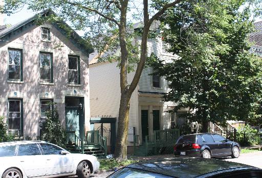 a view of street with parked cars