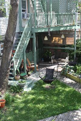 Undisclosed Address Chicago, IL 60642 - Photo 3 of 16 a view of a garden with a bench