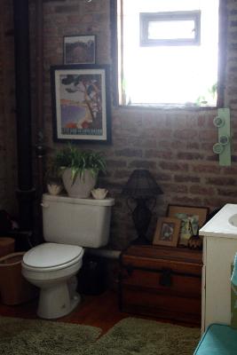 Undisclosed Address Chicago, IL 60642 - Photo 9 of 16 a bathroom with a toilet a sink and a window