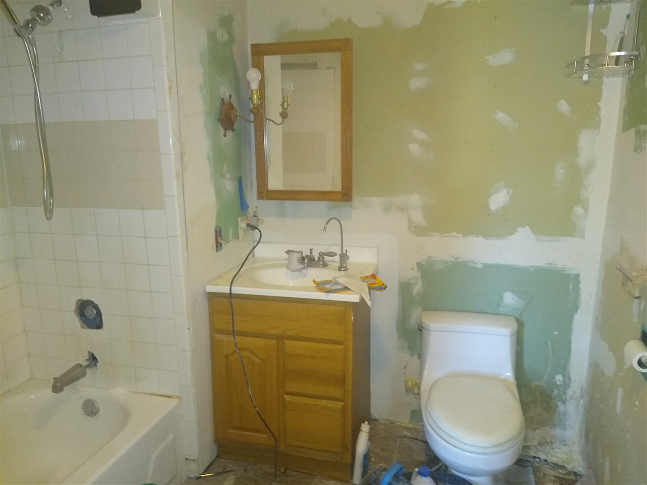 4025 River Road Cherry Valley, IL 61016 - Photo 8 of 10 a bathroom with a sink a toilet and shower