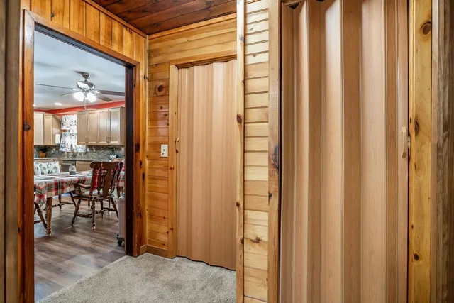 a bedroom with a bed and flat screen tv