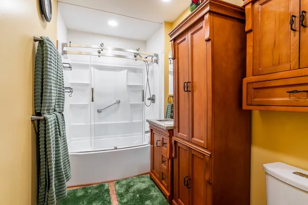 a view of a livingroom with furniture and shower