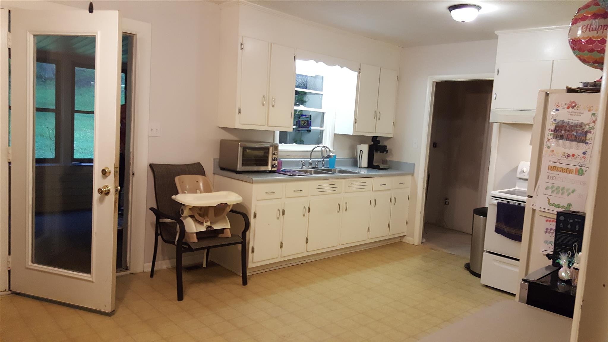 1232 Cliff Amos Road Spring Hill, TN 37174 - Photo 13 of 23 a kitchen with a sink appliances and cabinets