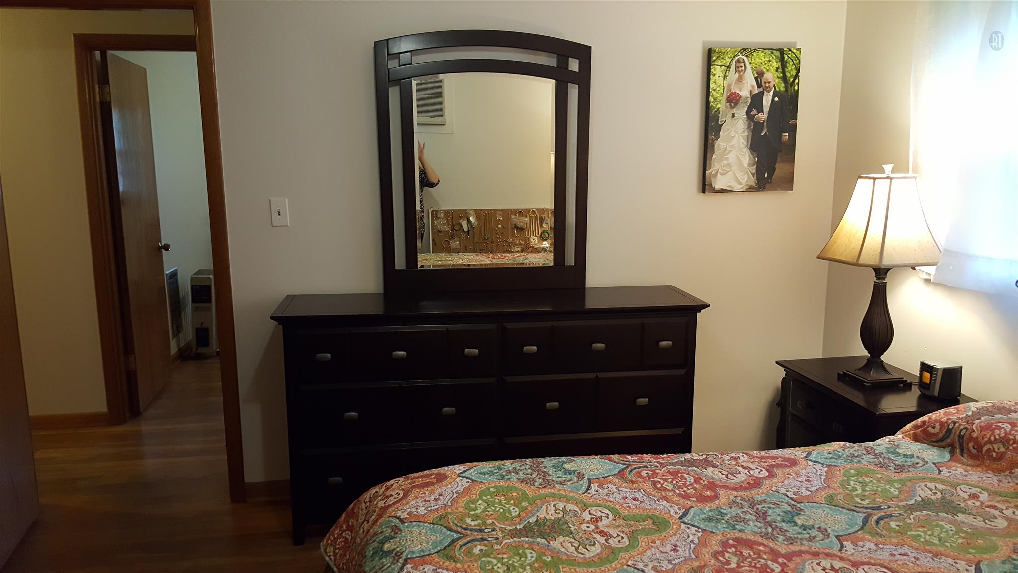 1232 Cliff Amos Road Spring Hill, TN 37174 - Photo 5 of 23 a bedroom with a bed and a lamp on dresser