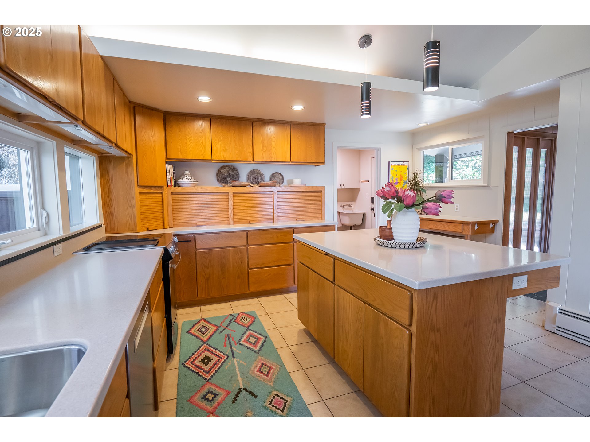 275 Sunset Drive Eugene, OR 97403 - Photo 13 of 45 a kitchen with stainless steel appliances kitchen island granite countertop a sink and cabinets