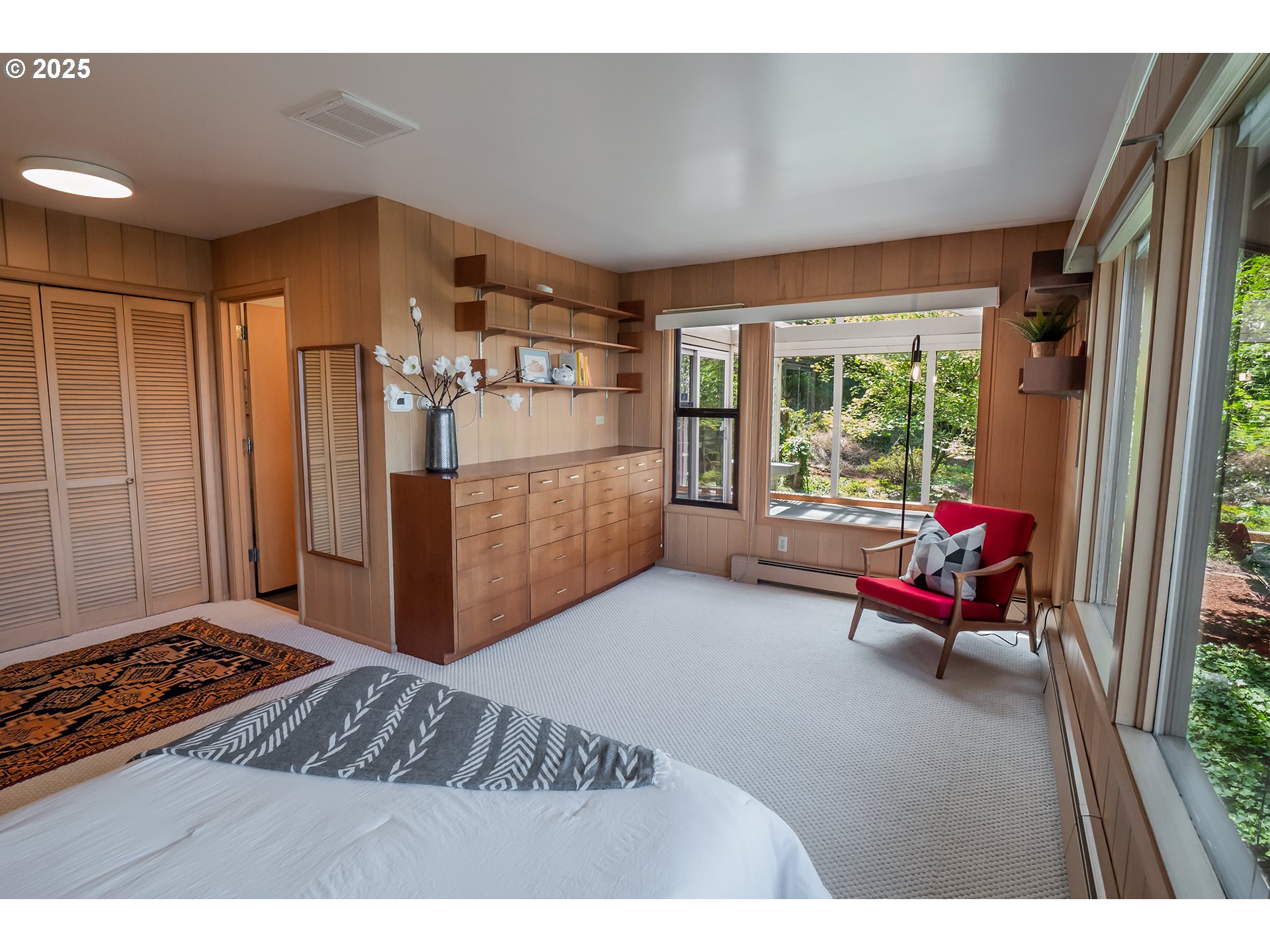 275 Sunset Drive Eugene, OR 97403 - Photo 18 of 45 a bedroom with a bed and wooden floor