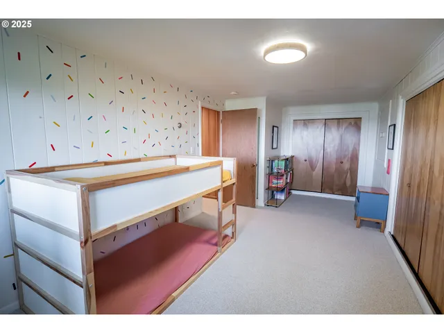 a bathroom with a double vanity sink and a large mirror