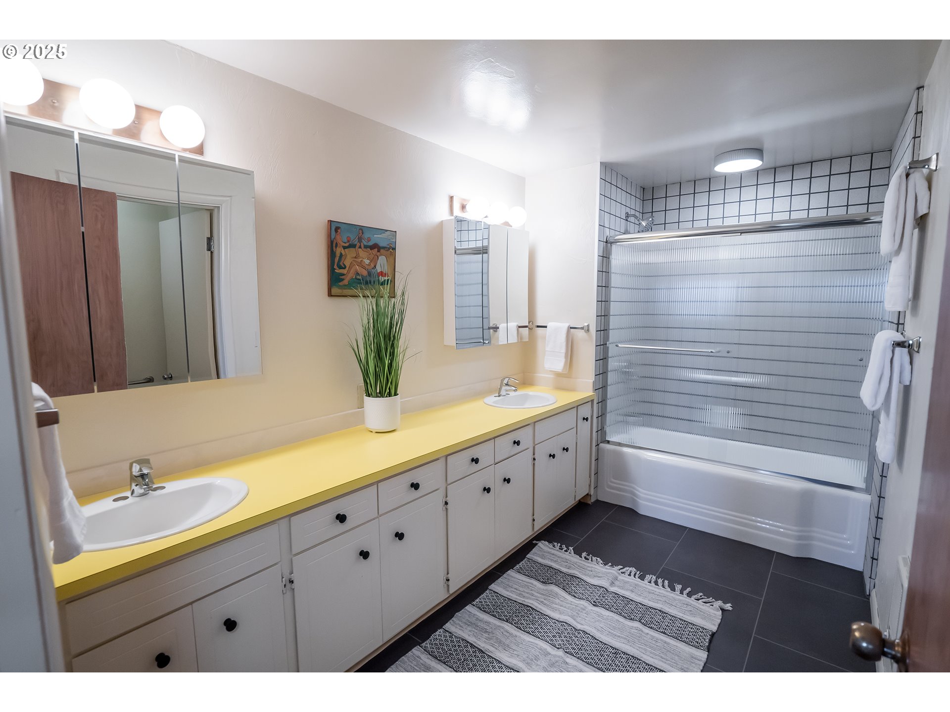 275 Sunset Drive Eugene, OR 97403 - Photo 28 of 45 a bathroom with a double vanity sink and a large mirror