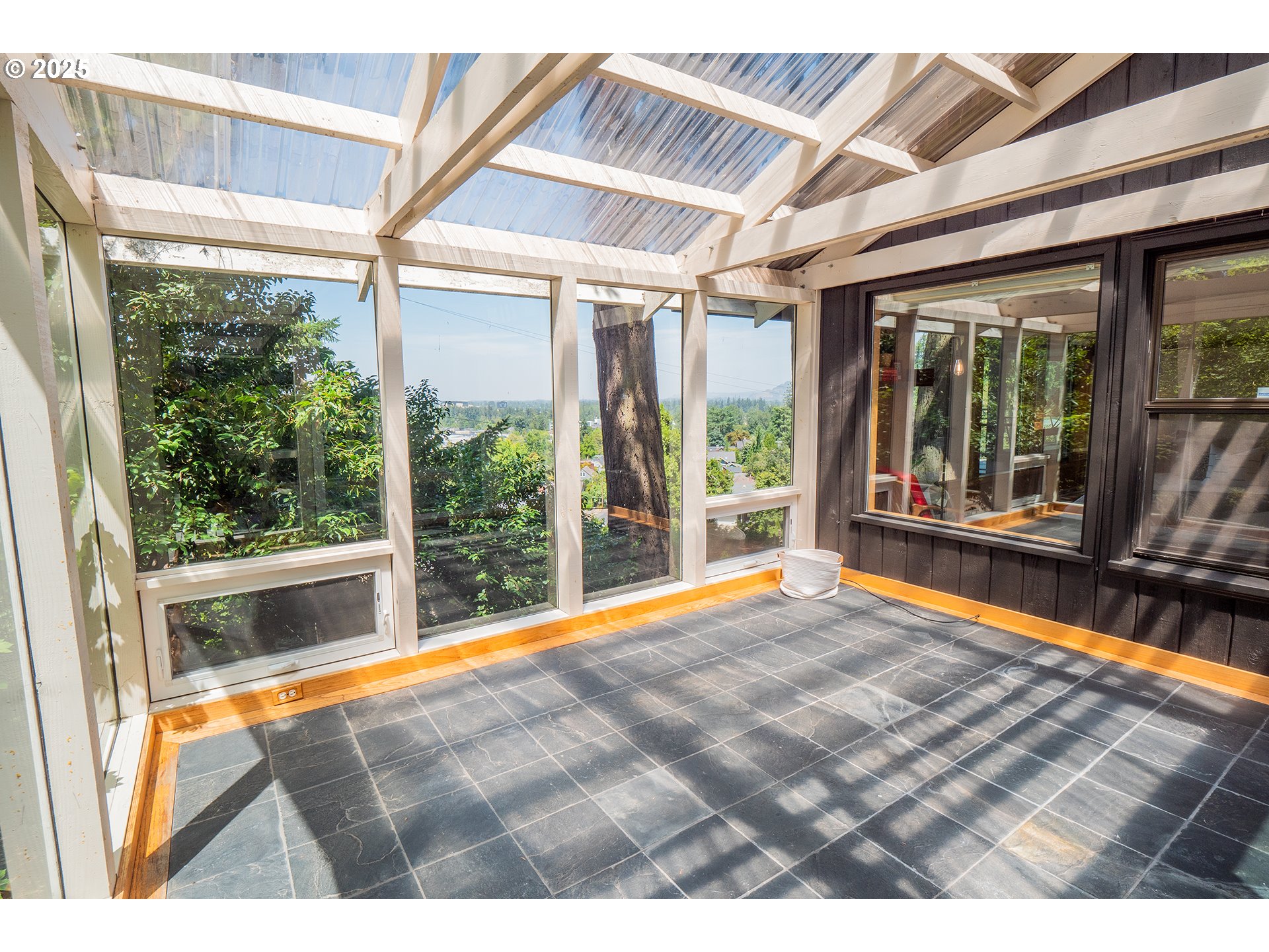 275 Sunset Drive Eugene, OR 97403 - Photo 34 of 45 a view of an empty room with wooden floor and a large window