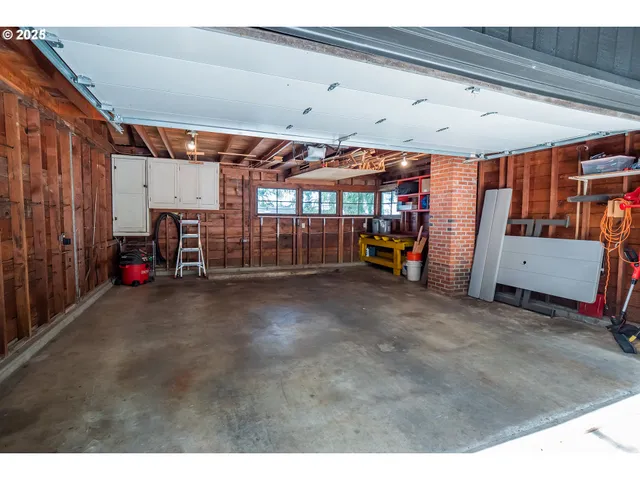 a view of balcony with furniture and umbrella