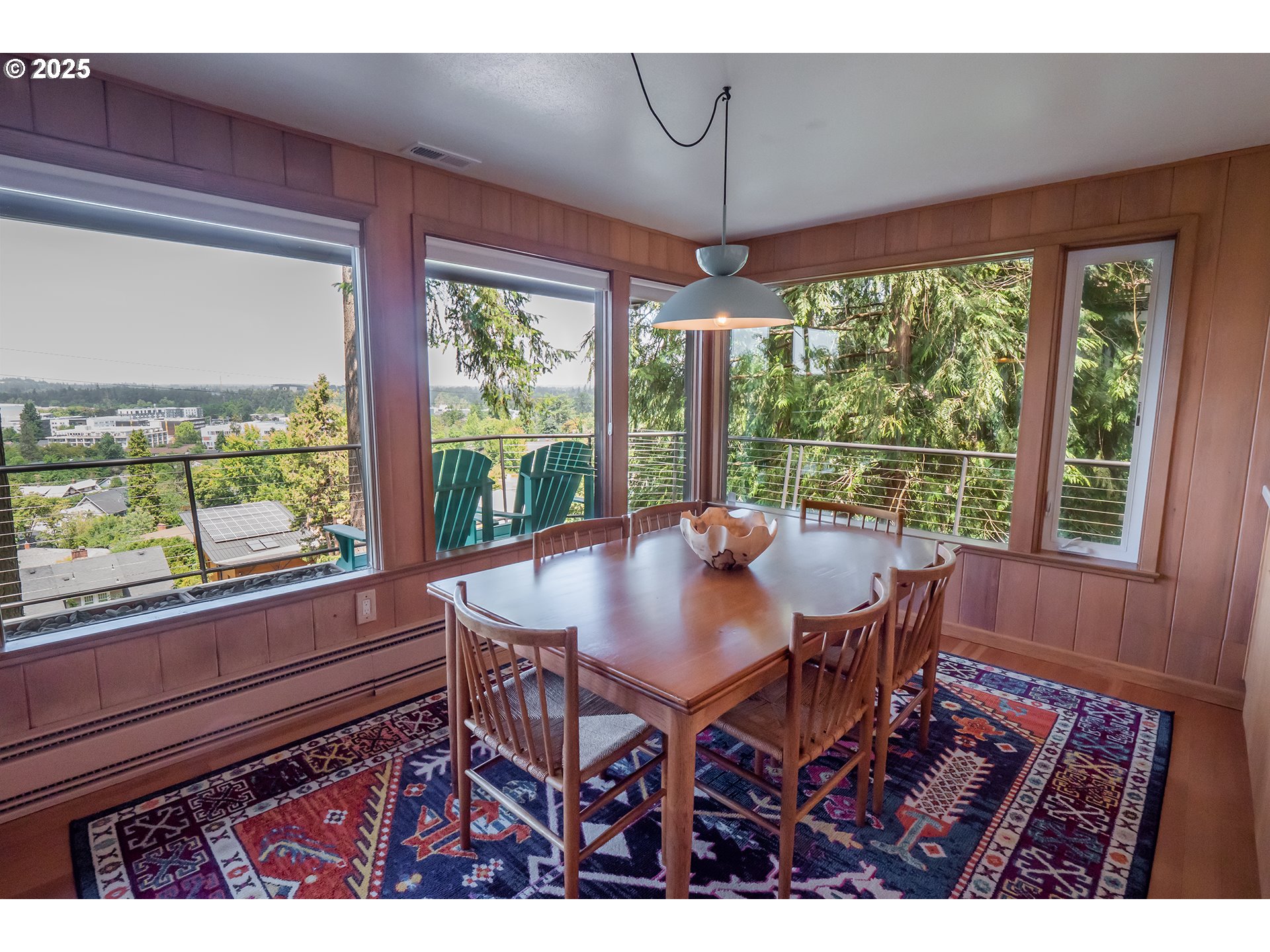 275 Sunset Drive Eugene, OR 97403 - Photo 9 of 45 a view of a dining room with furniture large windows and wooden floor