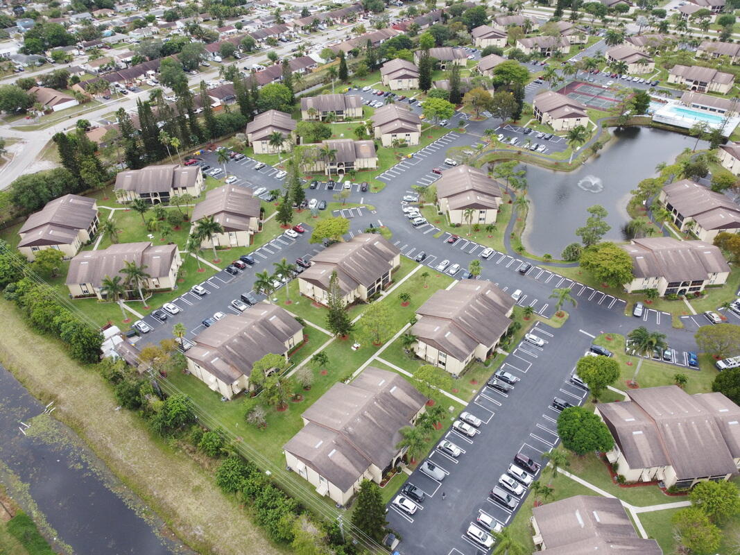 320 Pine Ridge Circle, Unit A1 Greenacres, FL 33463 - Photo 37 of 65 an aerial view of residential houses with outdoor space