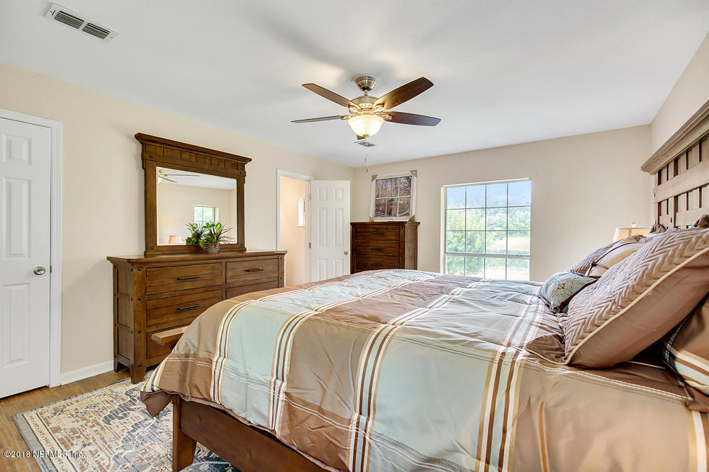 541103 Lem Turner Road Callahan, FL 32011 - Photo 36 of 58 a bedroom with a bed and a window