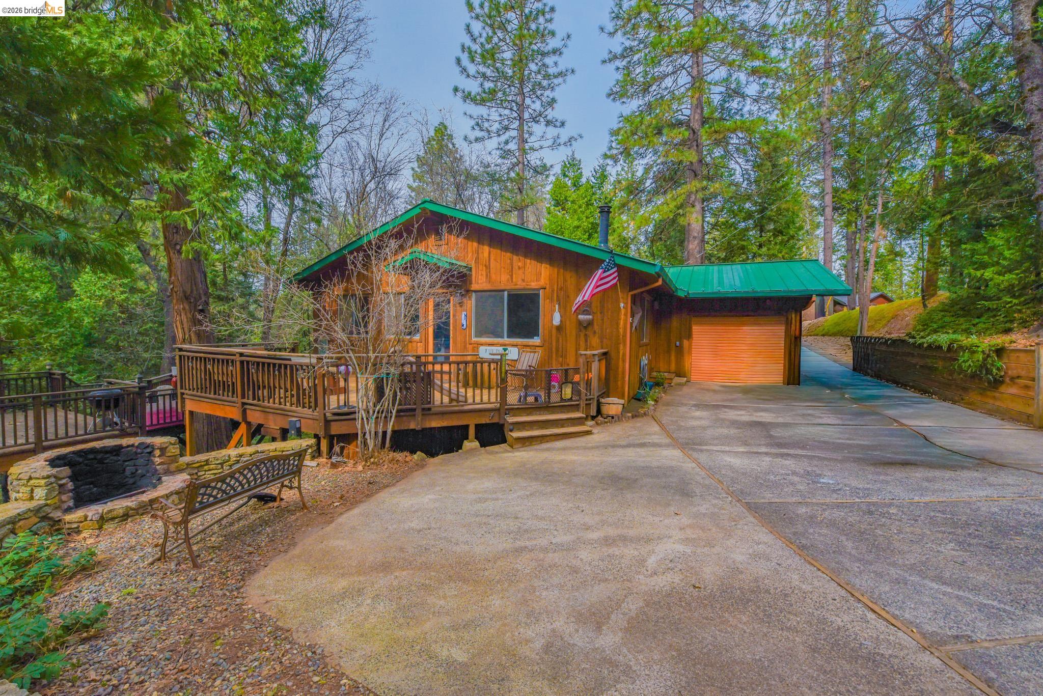 24132 Awahanee Road Sonora, CA 95370 - Photo 1 of 39 a view of a house with a yard and sitting area