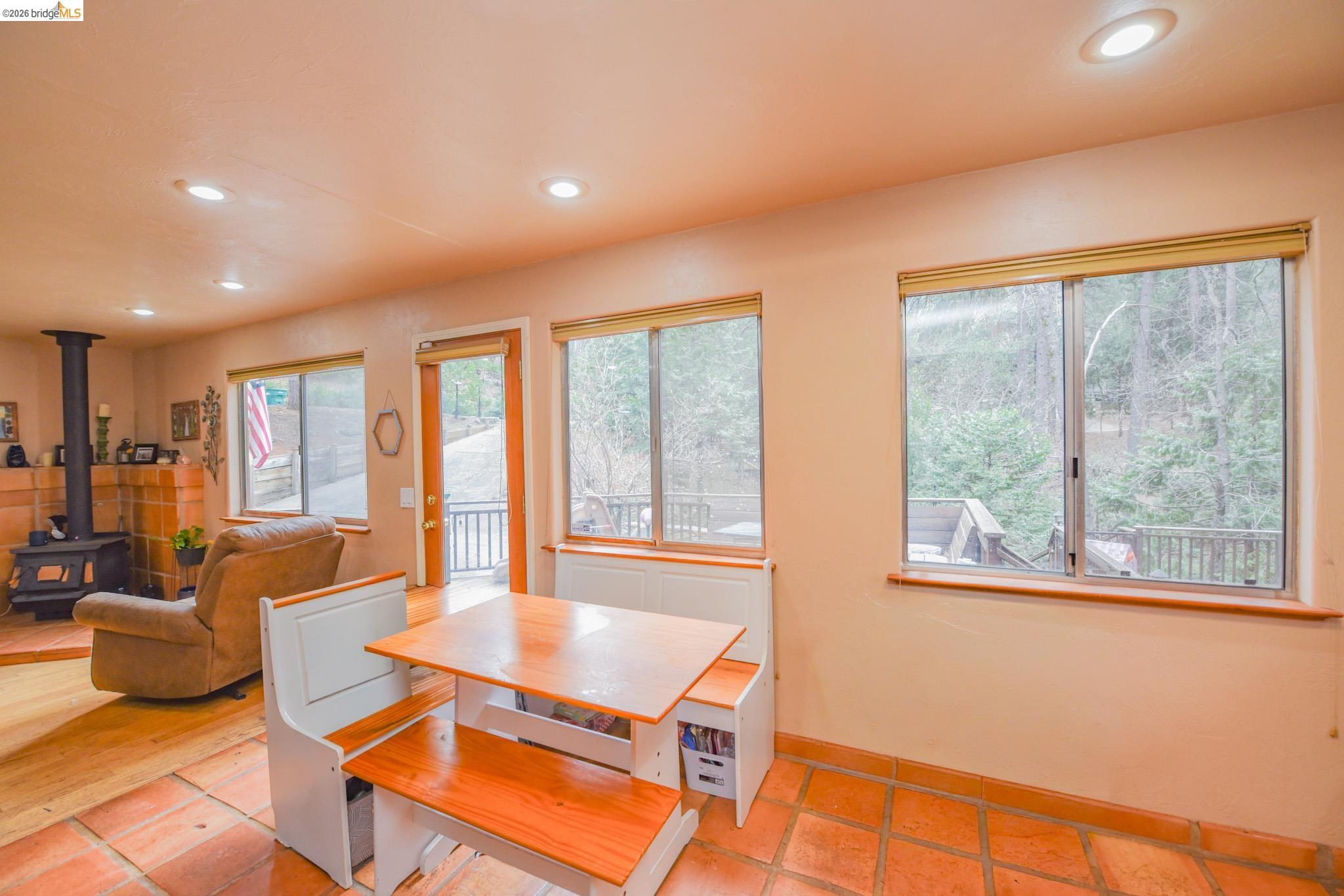 24132 Awahanee Road Sonora, CA 95370 - Photo 11 of 39 a living room with furniture and a large window