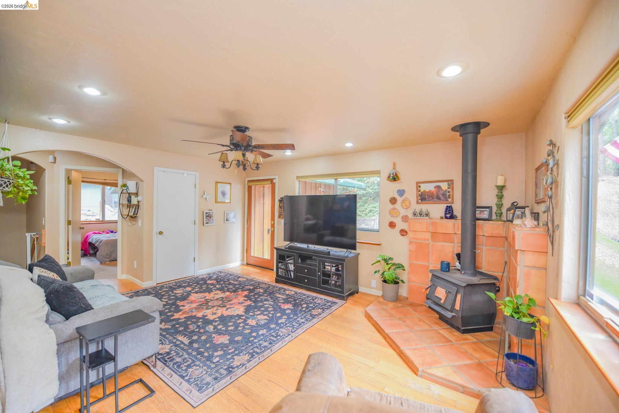 24132 Awahanee Road Sonora, CA 95370 - Photo 12 of 39 a living room with furniture and a flat screen tv