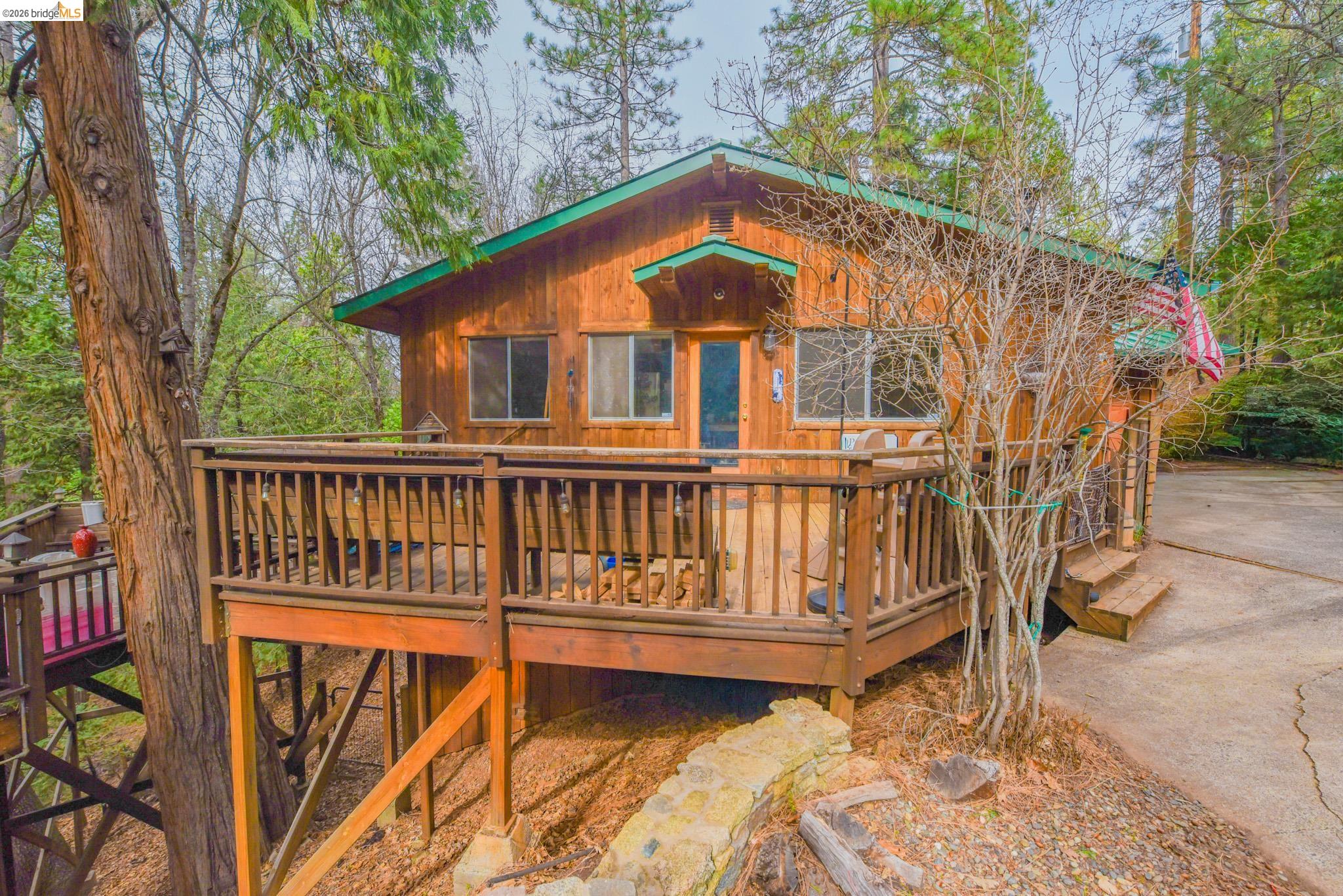 24132 Awahanee Road Sonora, CA 95370 - Photo 31 of 39 a view of backyard with a deck and furniture