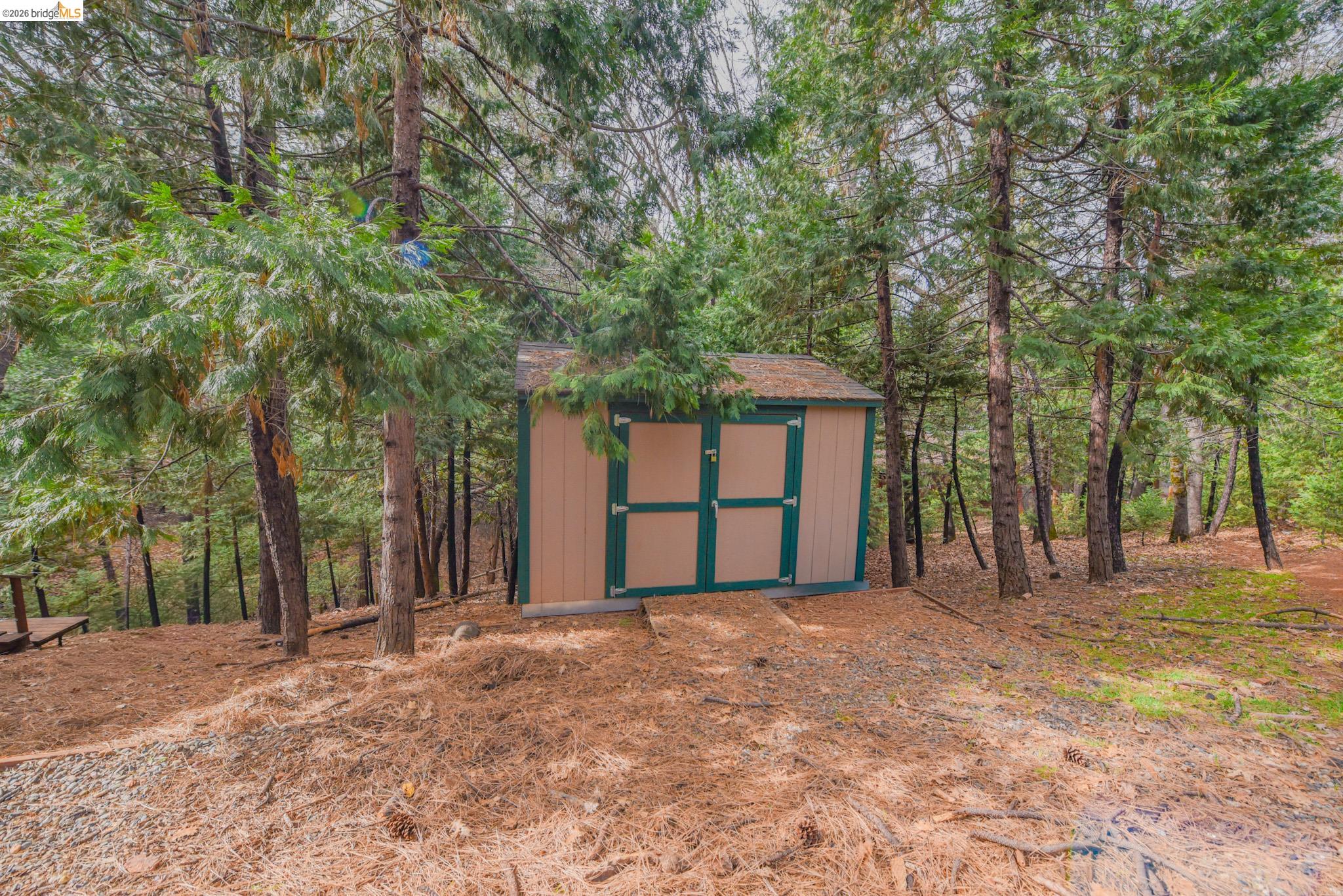 24132 Awahanee Road Sonora, CA 95370 - Photo 32 of 39 a front view of a house with a yard and garage