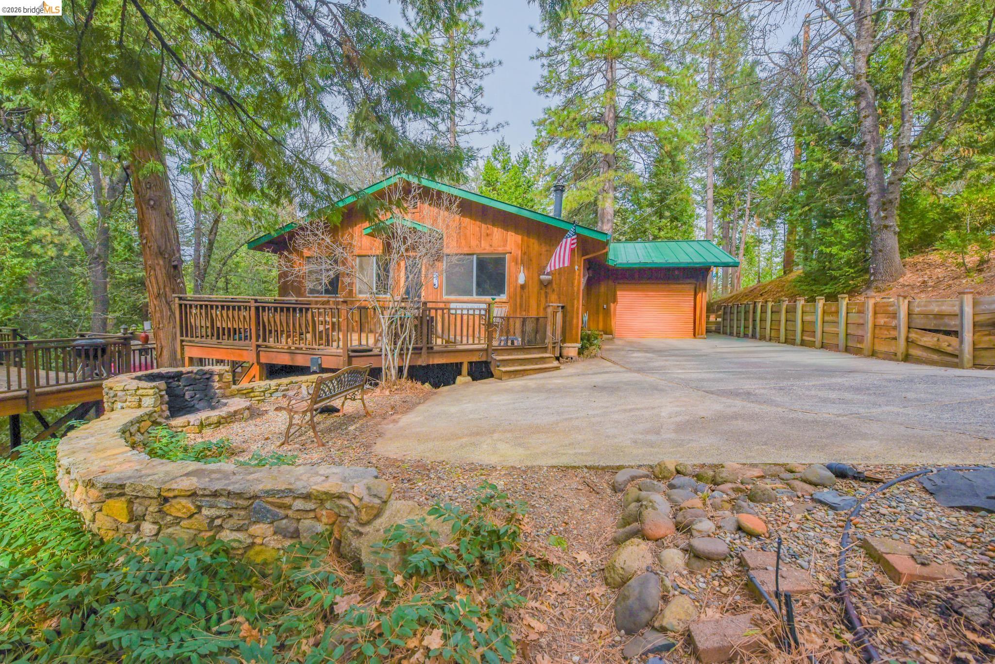 24132 Awahanee Road Sonora, CA 95370 - Photo 39 of 39 a view of a house with backyard and sitting area