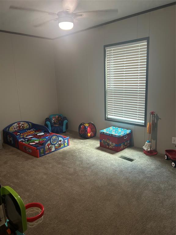 241 County Road 2168 Quitman, TX 75783 - Photo 11 of 11 a room with a bed and a chandelier