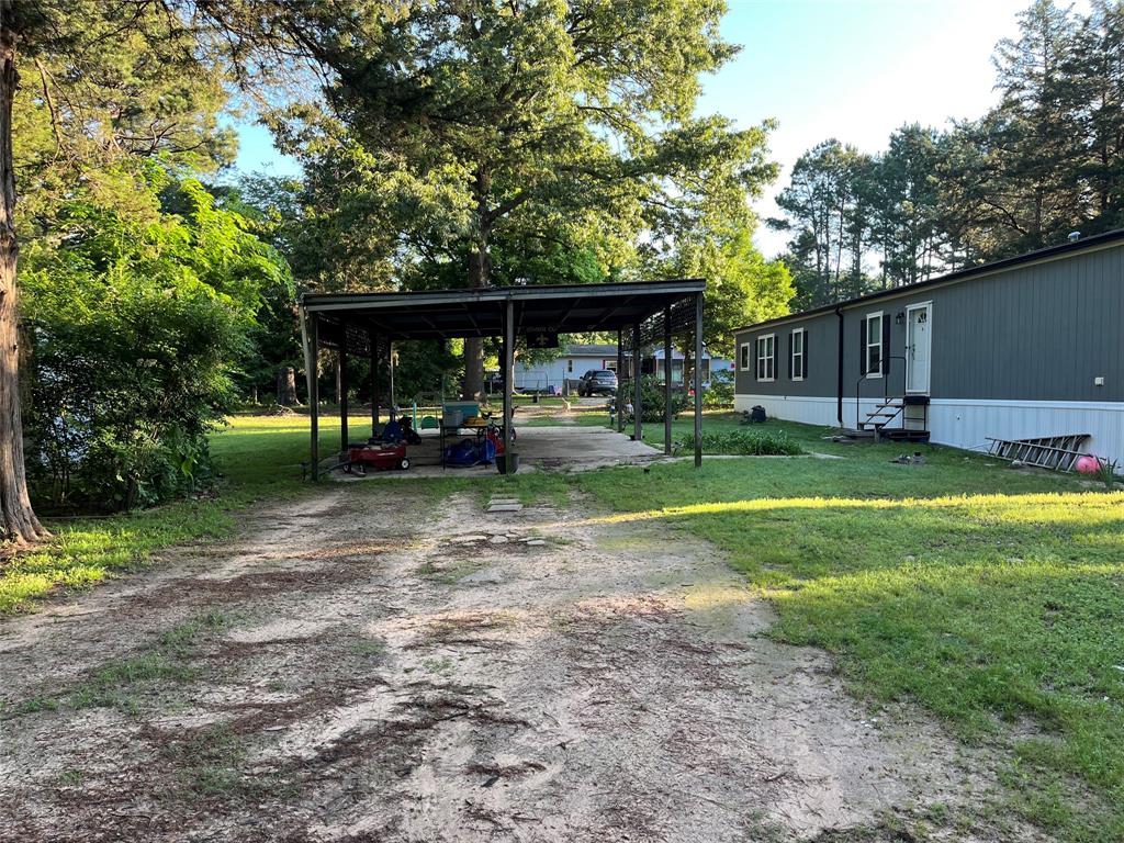 241 County Road 2168 Quitman, TX 75783 - Photo 2 of 11 a view of a house with backyard