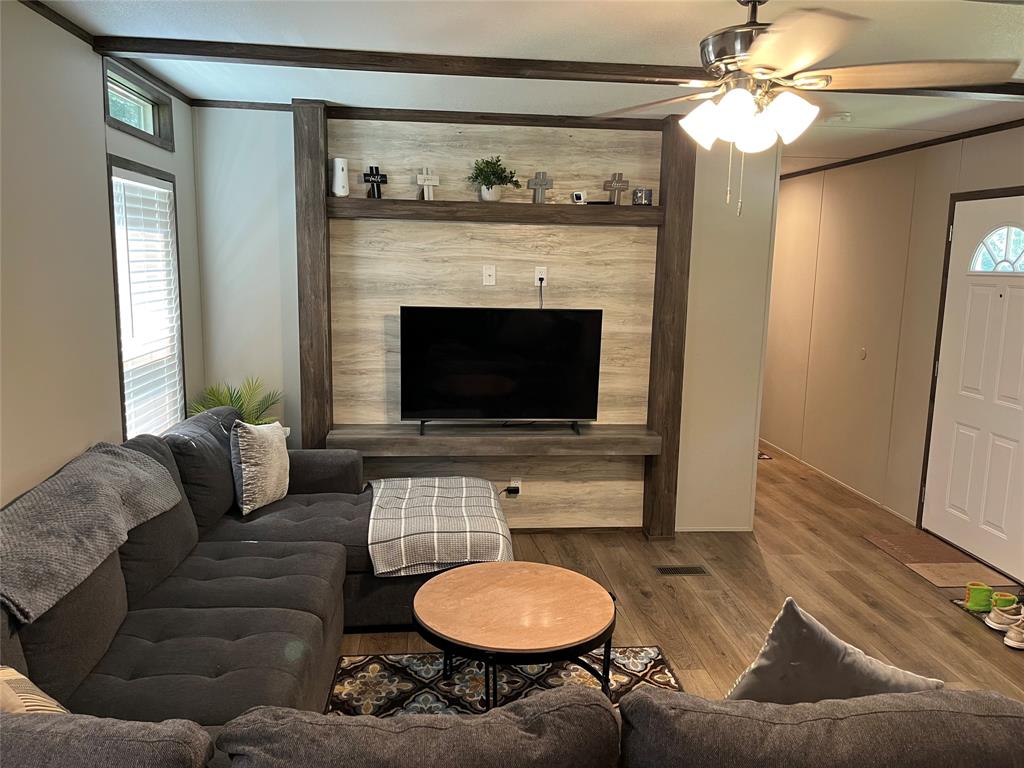 241 County Road 2168 Quitman, TX 75783 - Photo 5 of 11 a living room with furniture and a fireplace